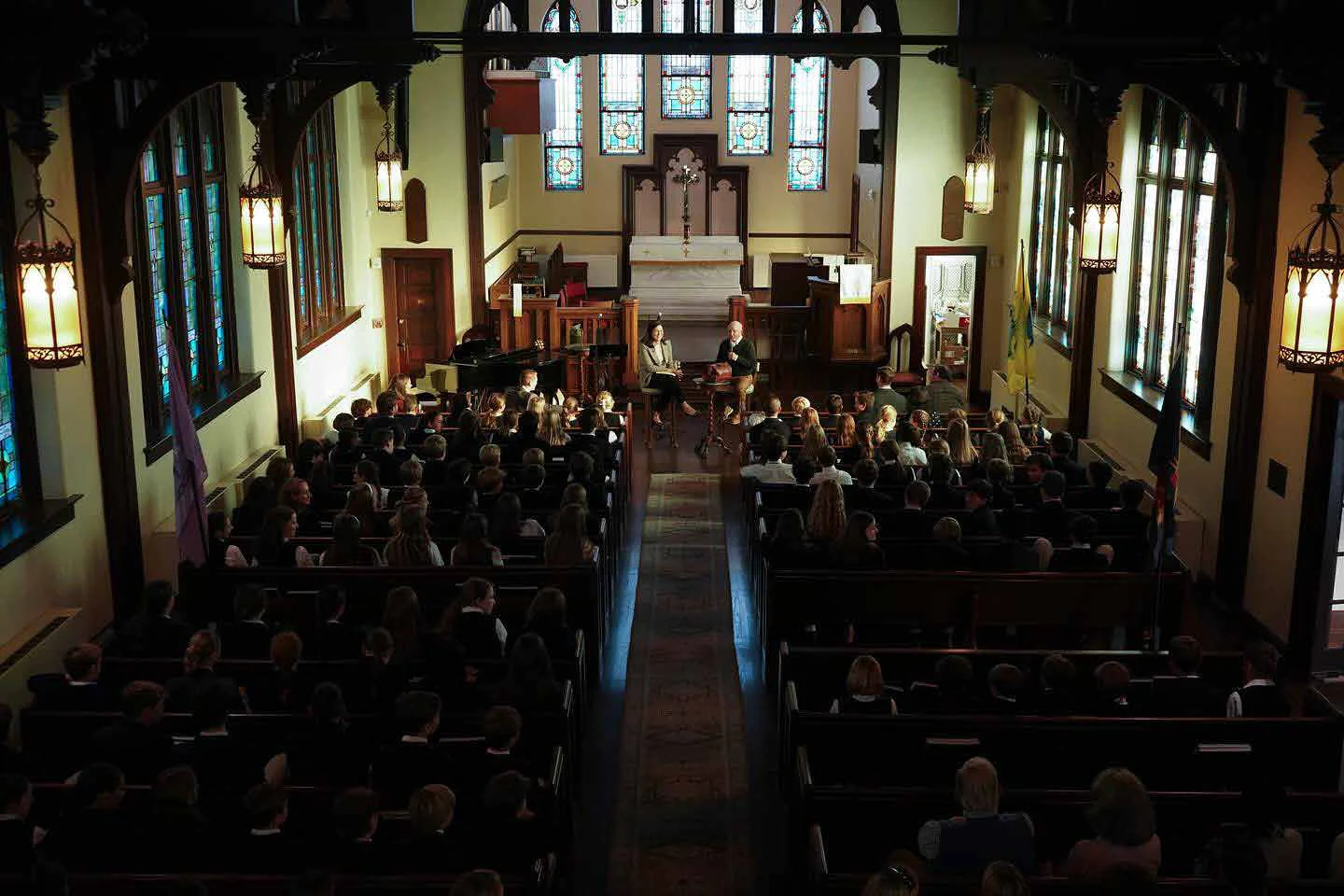 Students gathered in a chapel for an assembly