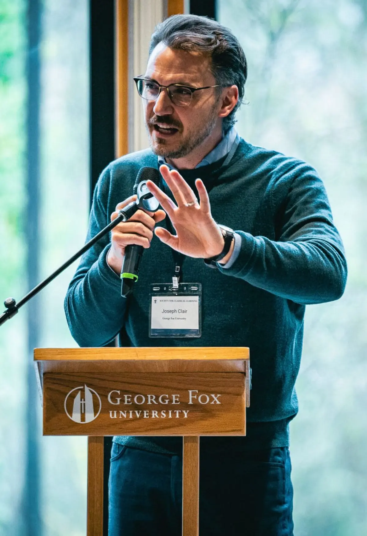 Speaker presenting at West Coast Symposium